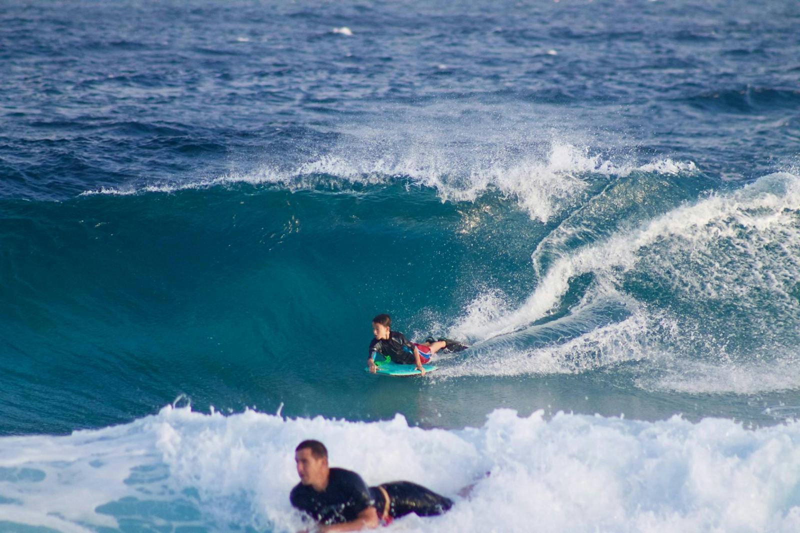 Moses Finlay bodyboarding with his dad in Hawaii.